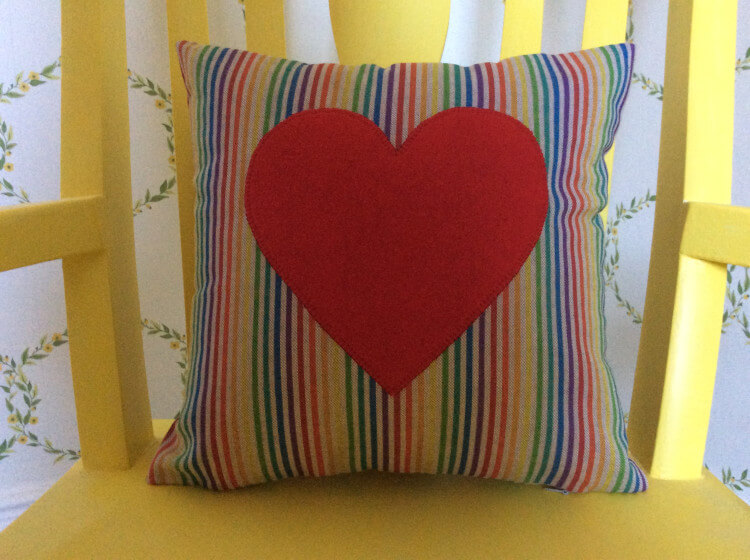 Striped cushion with large heart